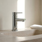Chrome Basin Mixer Round Spout on a neutral toned marble sink