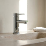 Chrome Basin Mixer Round Spout on a neutral toned marble sink
