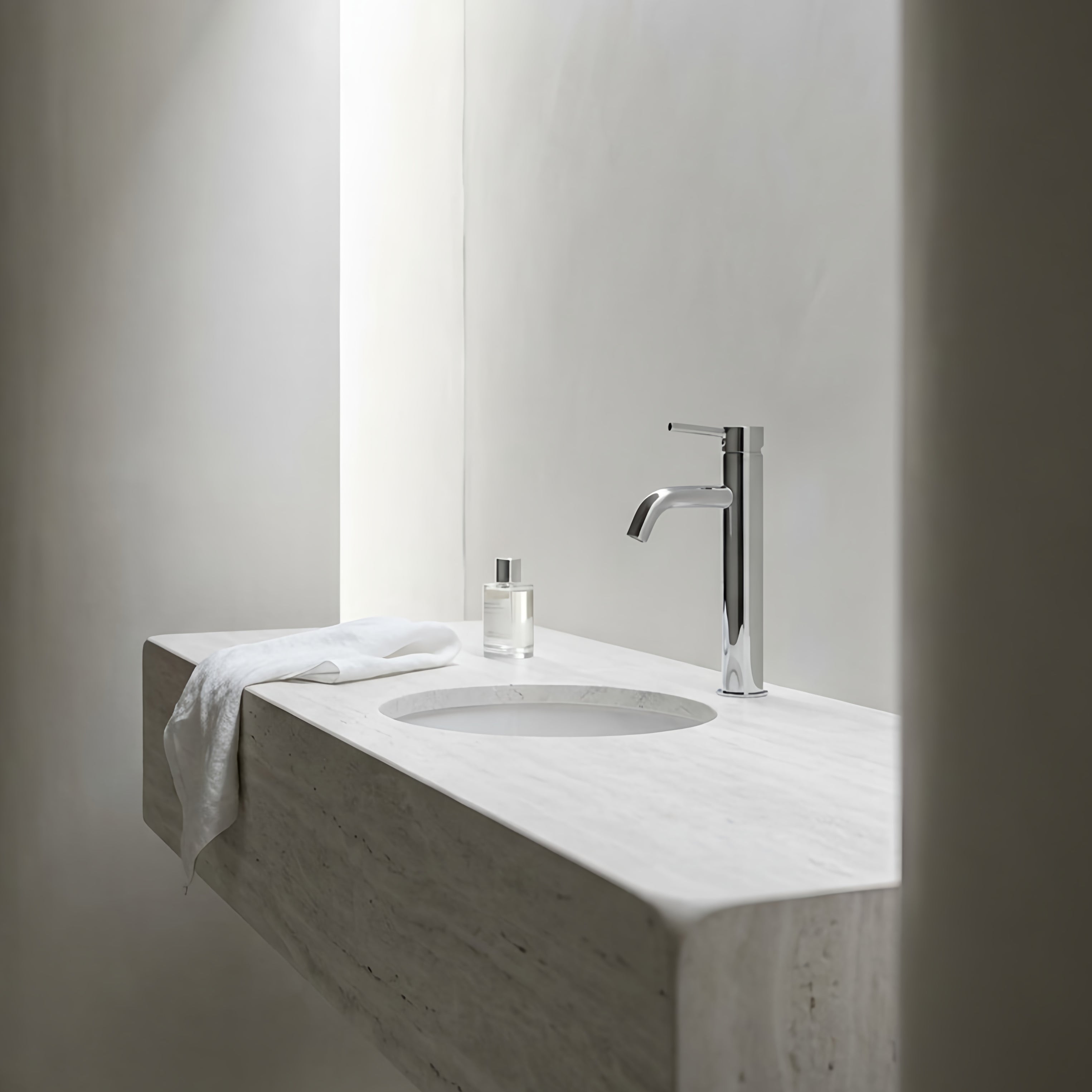 Minimalist bathroom vanity with tall basin mixer in chrome