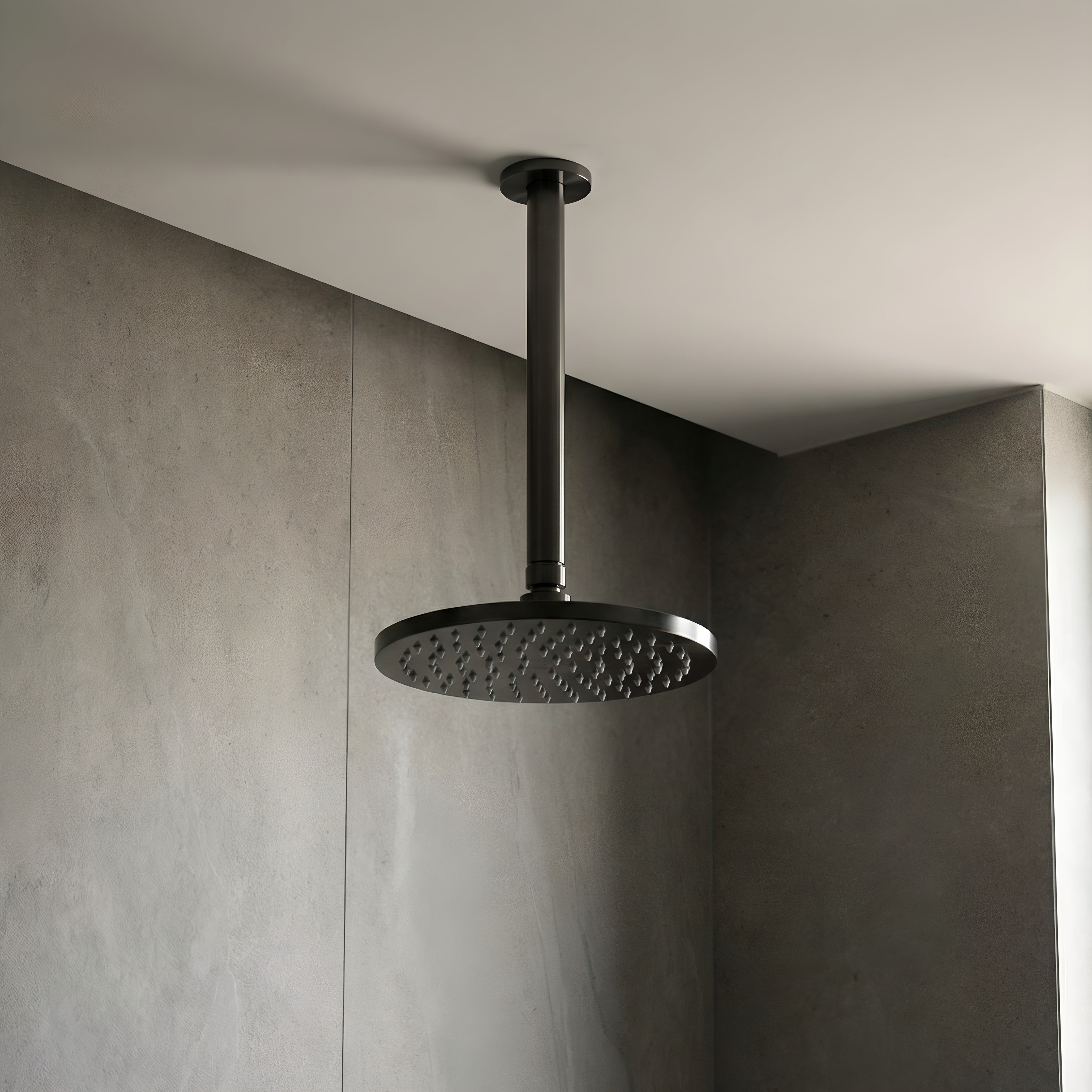Gun Metal ceiling arm shown with shower head in a bathroom