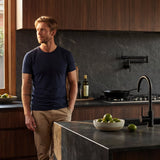 The Notorious Collective Kitchen Laundry Pull out mixer and pot filler  in matt black shown in modern kitchen