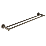 an antique brass double towel rail wall mounted set against a white background
