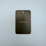 Antique brass sample disc on a white background
