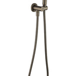 an antique brass shower handpiece mounted on a bracket, with a hose attached to it on a white background
