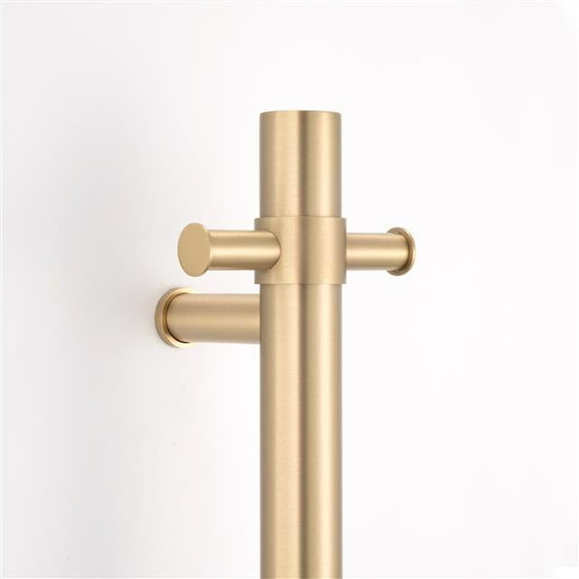 brushed gold single upright bar heated towel rail on a white background lifestyle