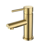 A brushed gold basin mixer tap with a round spout on a white background