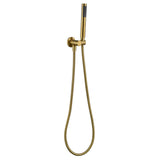 a brushed gold shower handpiece mounted on a bracket, with a hose attached to it on a white background