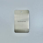 brushed nickel sample disc on a grey background