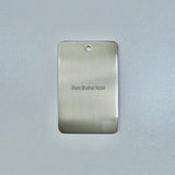 brushed nickel sample disc on a grey background