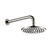 brushed nickel round shower head on wall with a white background