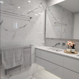a chrome double towel rail on a marble wall background