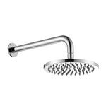 chrome round shower head on wall with a white background