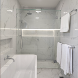 a chrome single towel rail on a marble wall backgroud