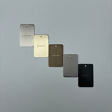 Five metal color samples labeled 'Warm Brushed Nickel', 'Brushed Gold', 'Antique Brass', 'Gun Metal', and 'Matt Black' on a grey background.