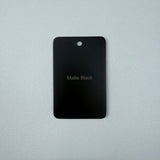 Matt Black sample disc on a grey background