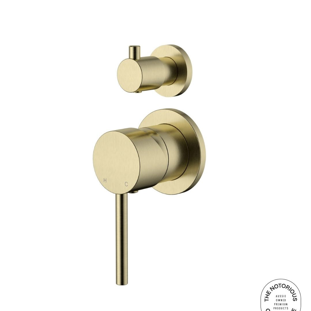 Brushed gold wall mixer with diverter on a white background